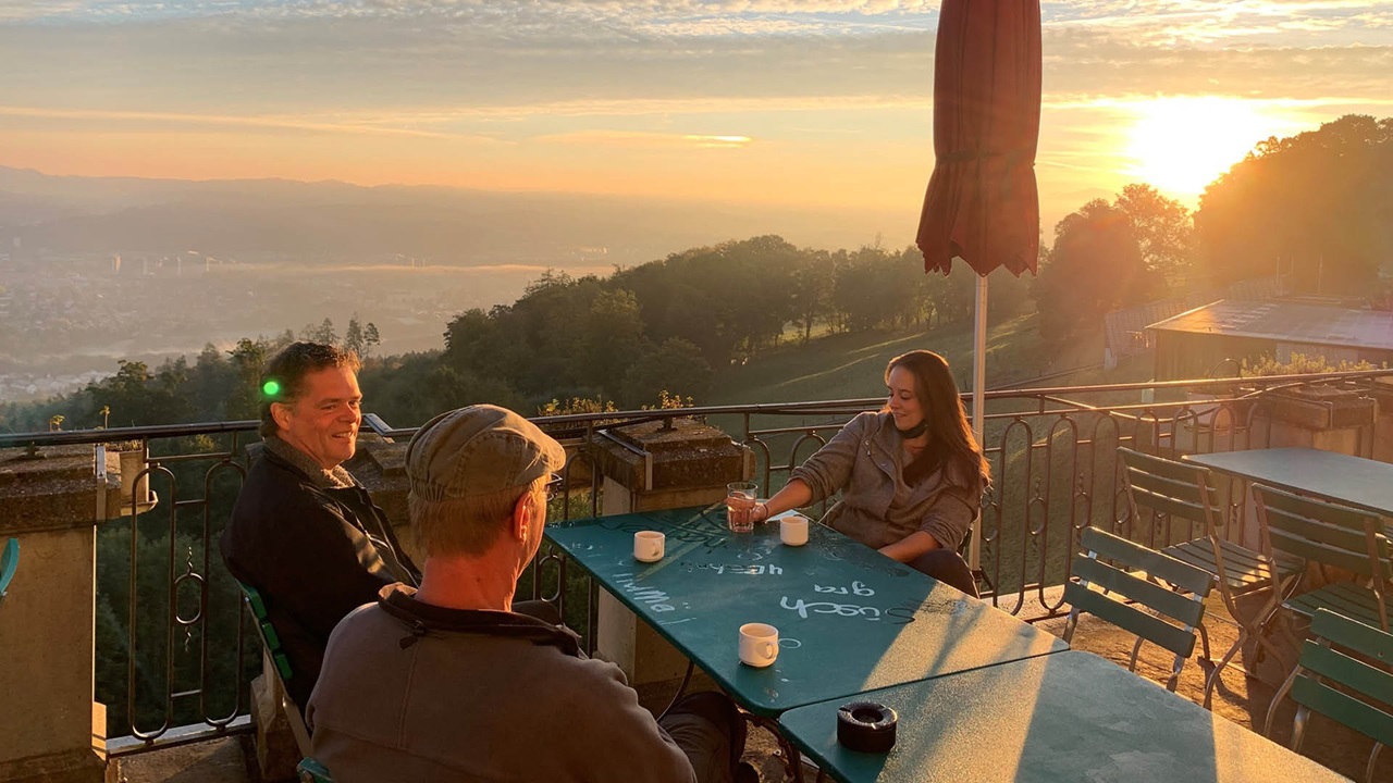 Employees having a coffee break on the terrace of Tapis Rouge restaurant