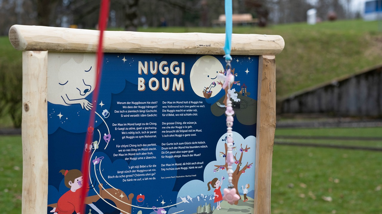 A poster with the verse of the nuggi tree.