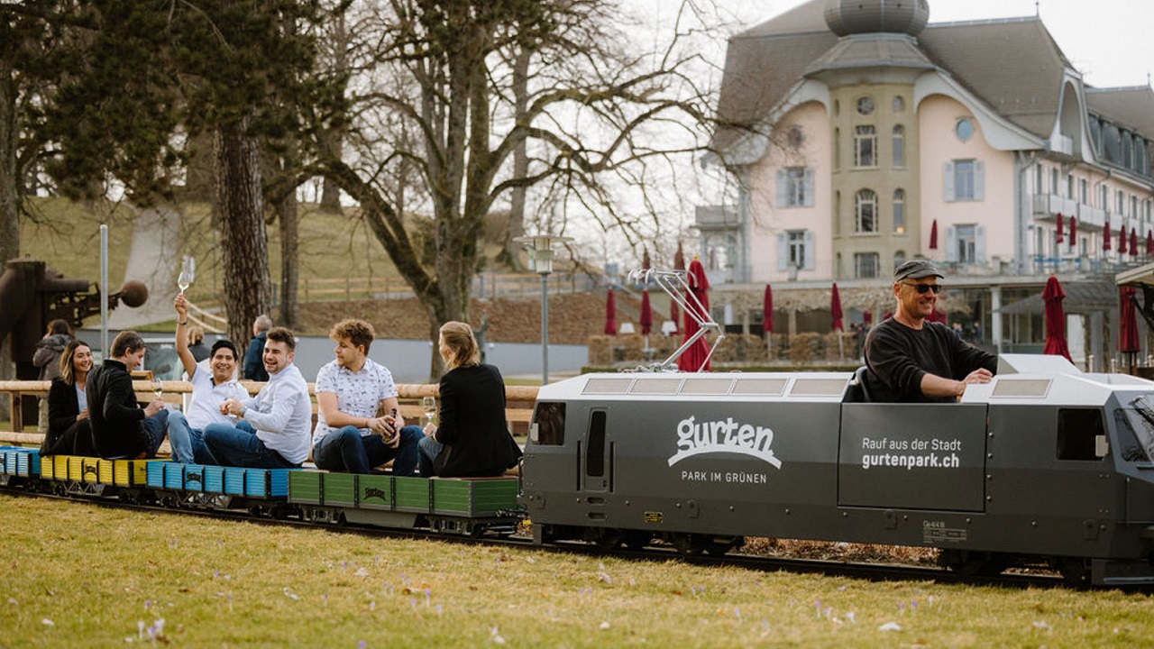 Group at the aperitif on the miniature railway in front of Gurten Kulm