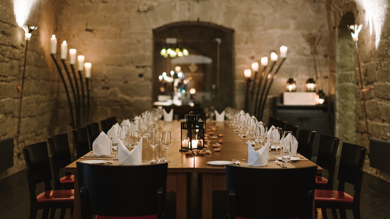 Festively laid table in the vaulted cellar