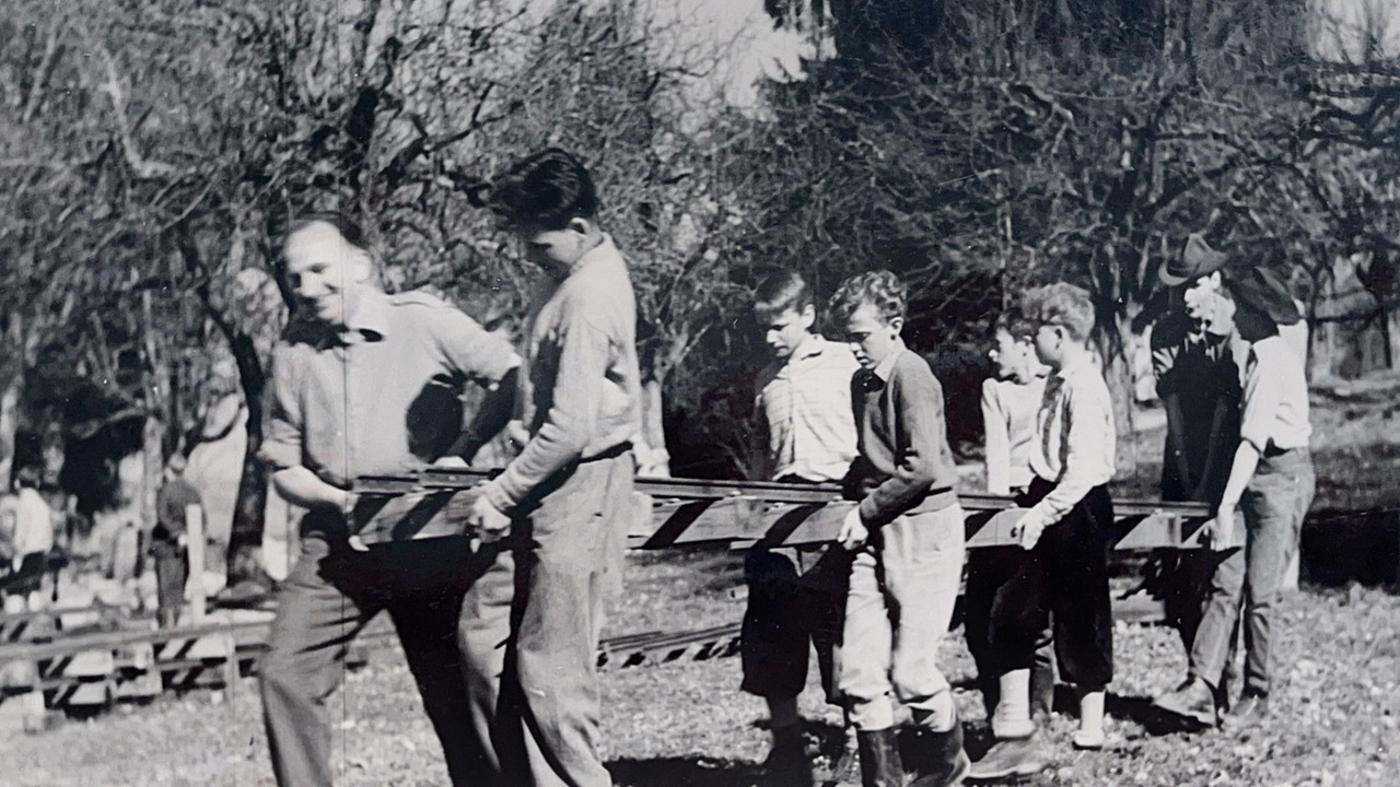  The men are moving the tracks to the right place. 