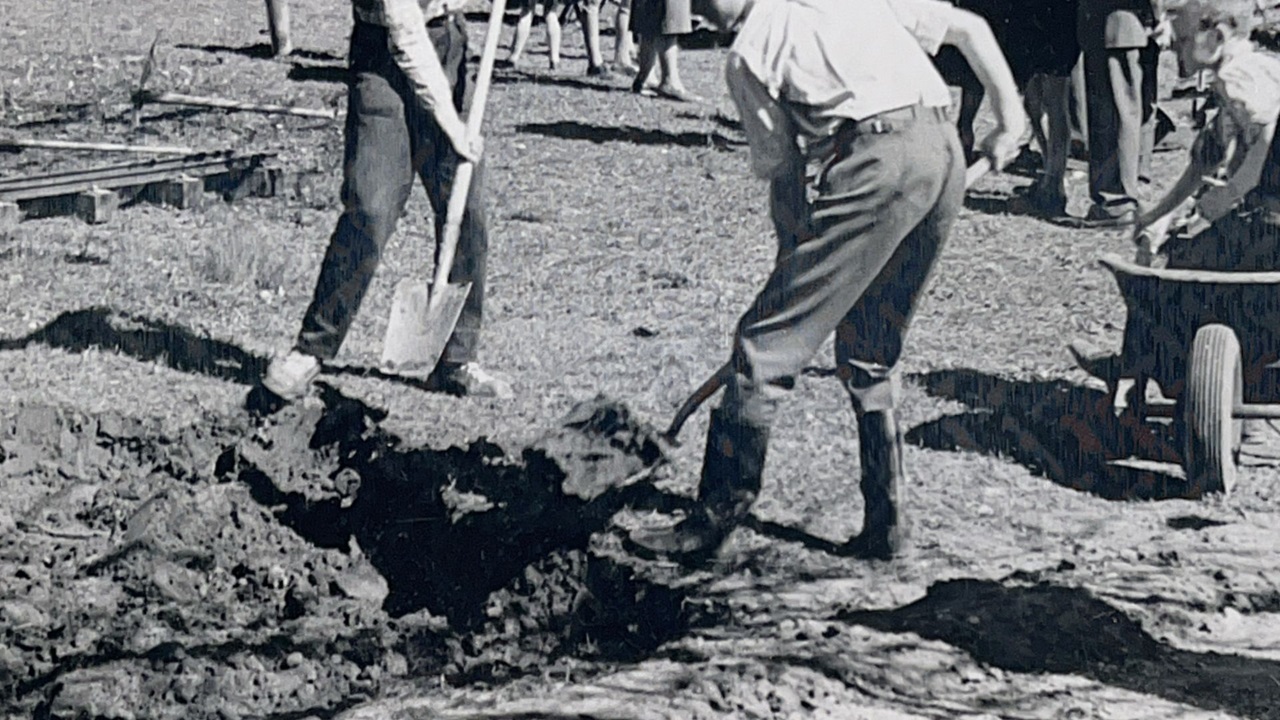 Men and boys working on the railroad.