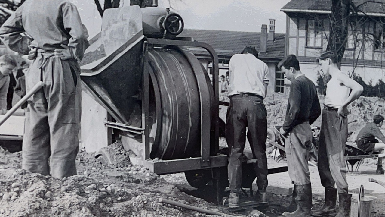 The men and boys bring the materials to the railroad.