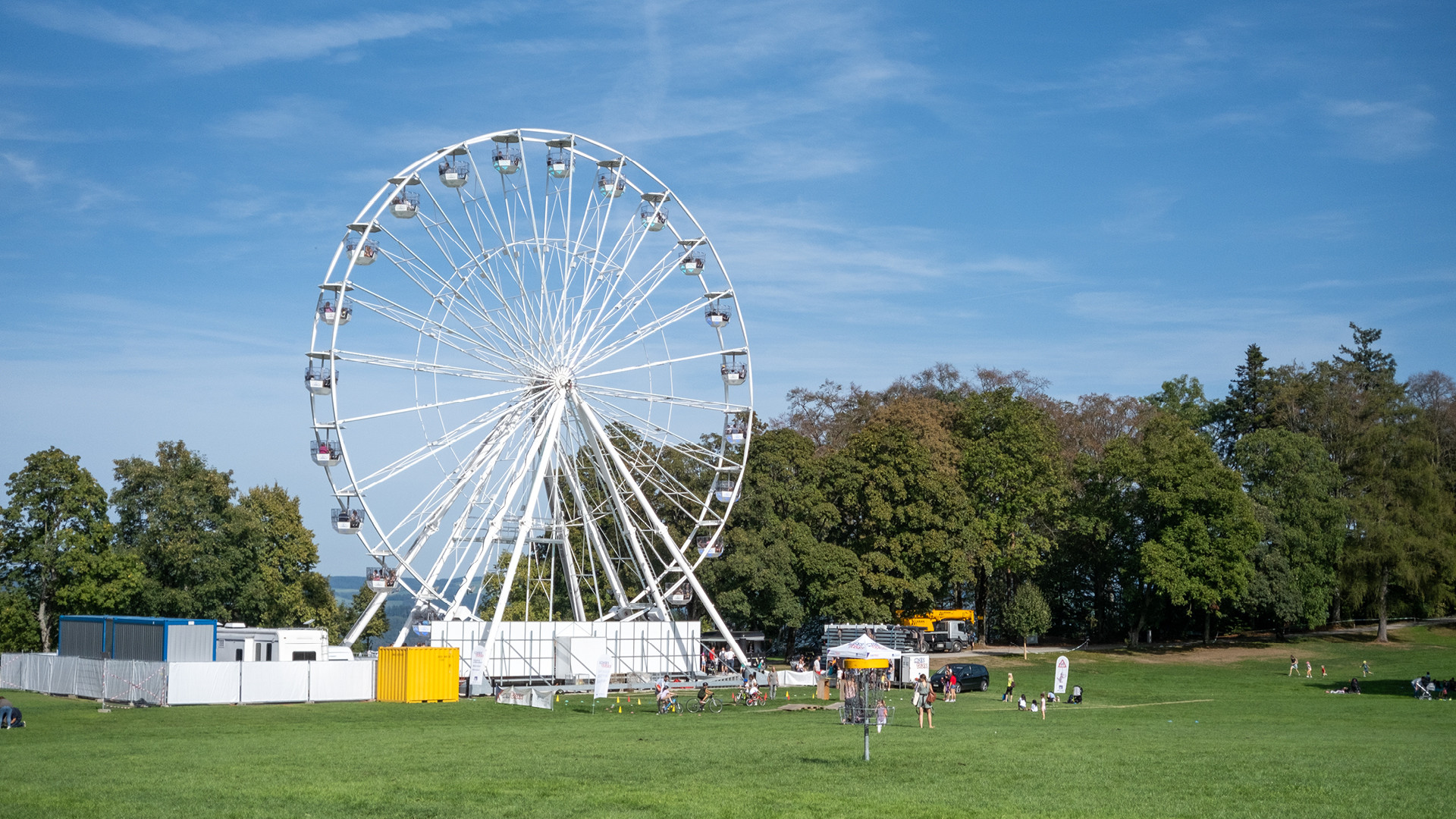  The white Ferris wheel with many visitors.