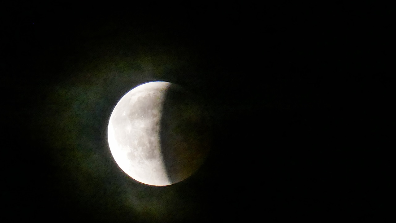 At the partial lunar eclipse the moon is in the shadow of the earth.