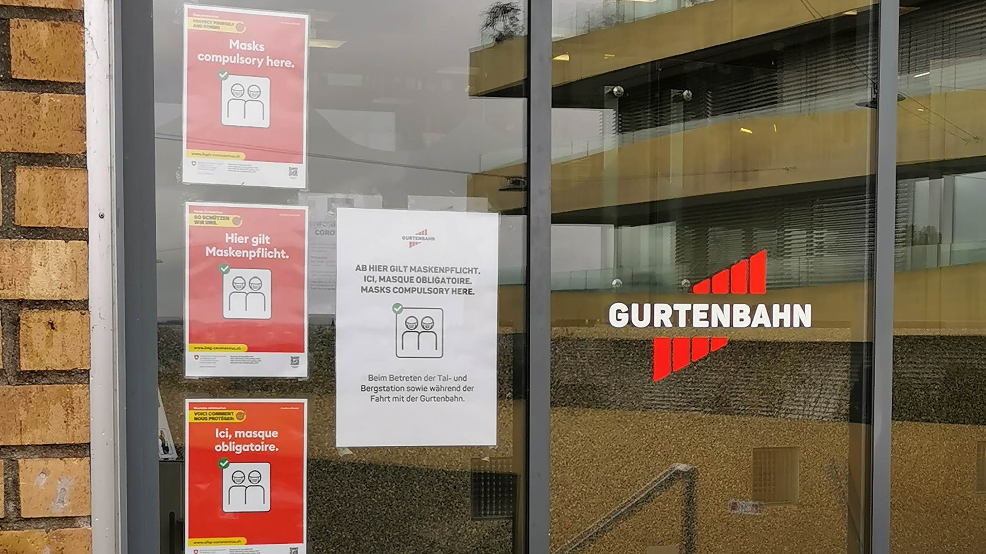 Image of the lower station window with coronavirus warning notices