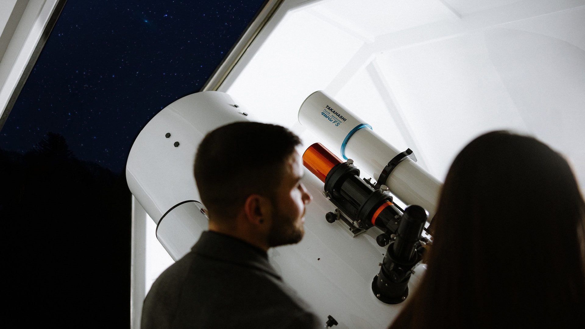 Couple at a telescope