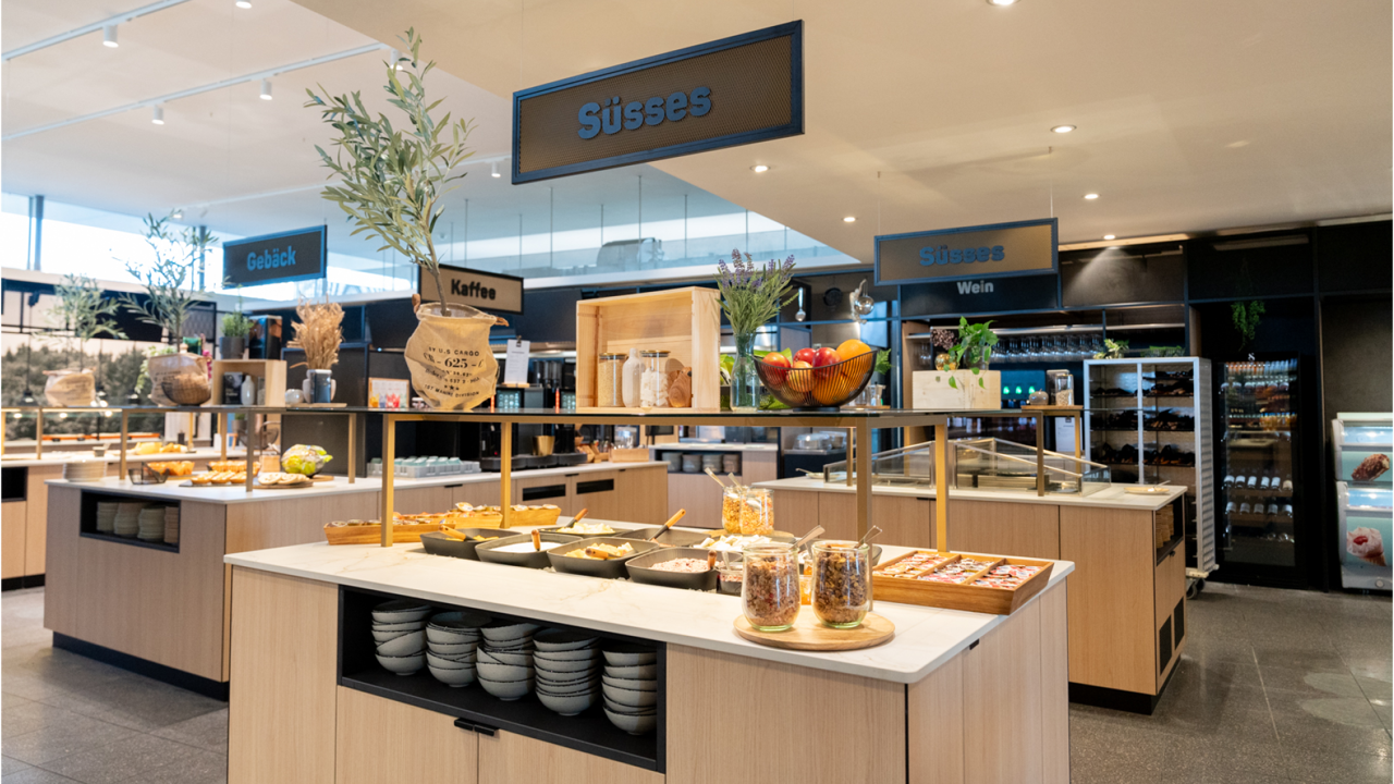 The Huusbüffe restaurant. There are buffets for sweet pastries, coffee, and salad.