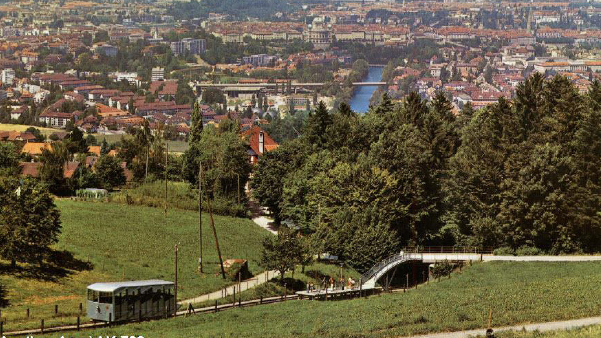 Old color photograph of the former Gurtenbahn railway with a view over the city and the Aare River