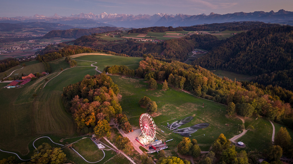 Saype's land art on Gurten set against the backdrop of the Bernese Alps.