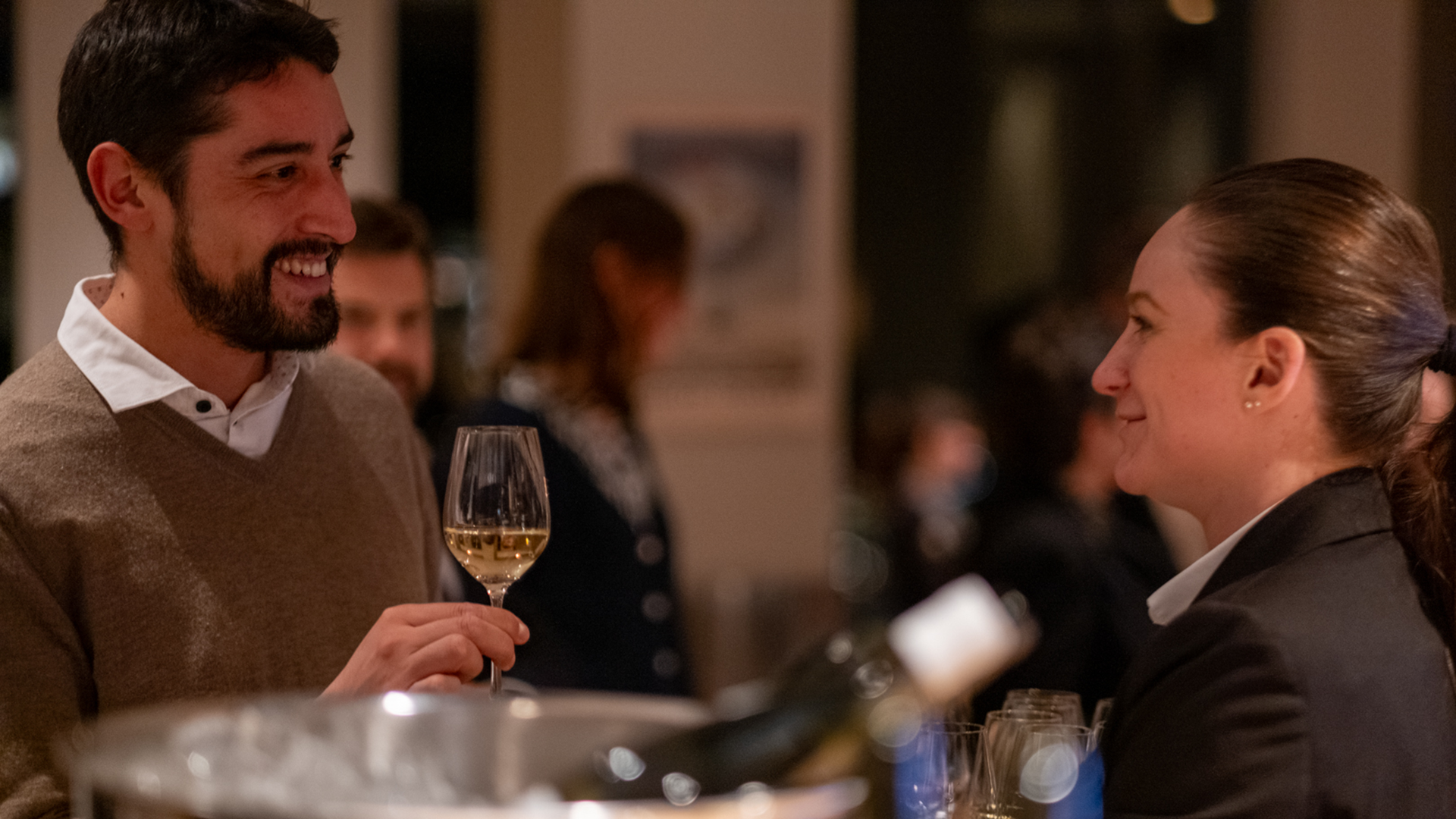 A guest raises a toast with the management of Gurtners to a successful wine&dine