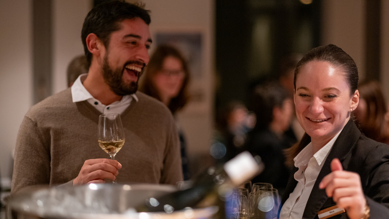 A guest raises a toast with the management of Gurtners to a successful wine tour